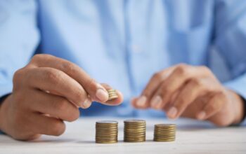 A person stacking coins
