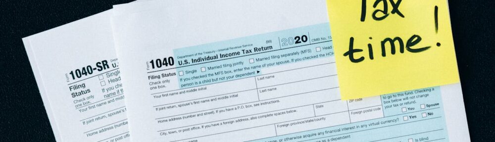 Tax documents on a black surface