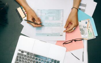 Person writing on a piece of document